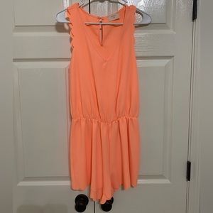 Orange, scalloped romper
